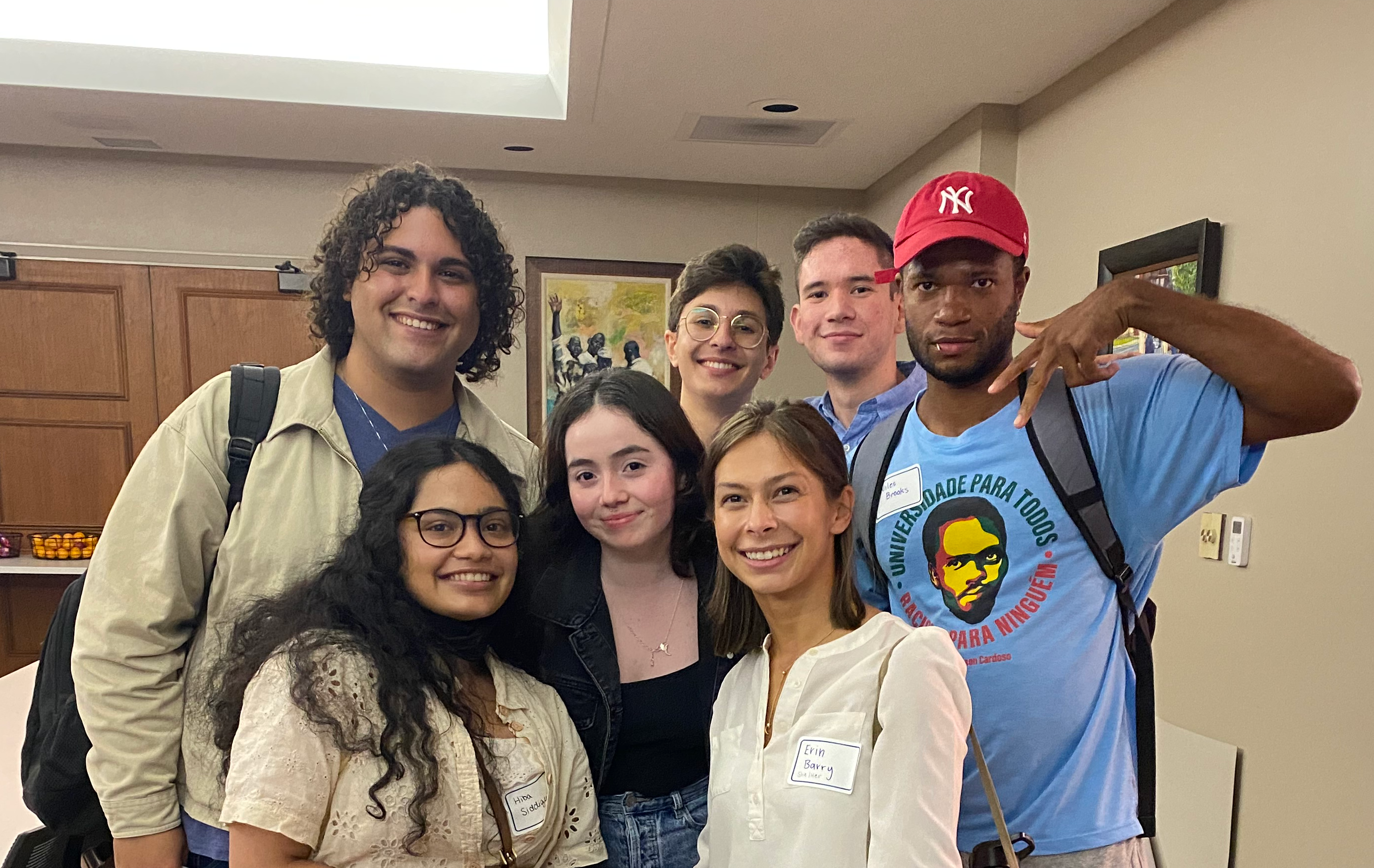 A group of rhizome members in a classroom smiling.