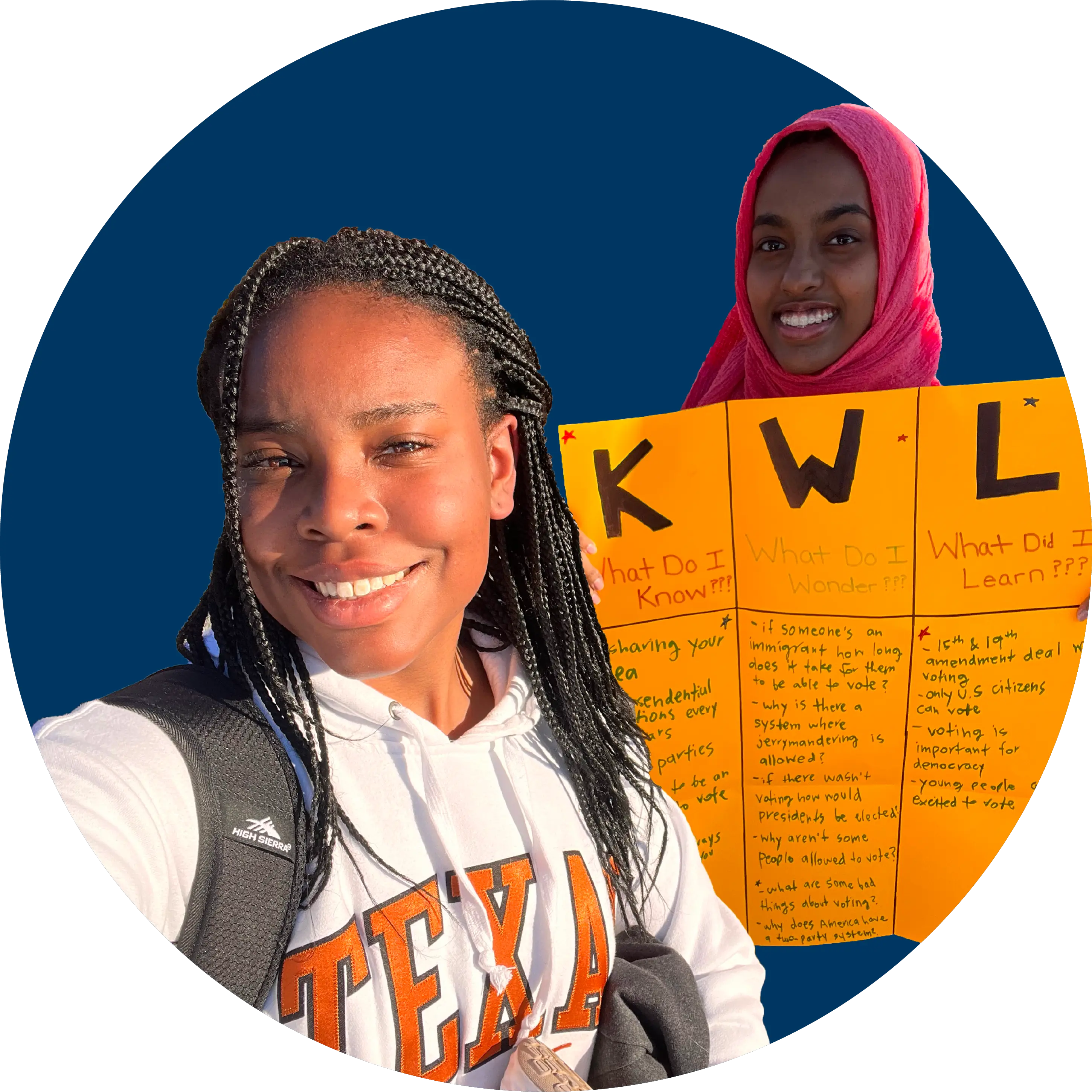 A student taking a selfie of herself and another student with a poster.